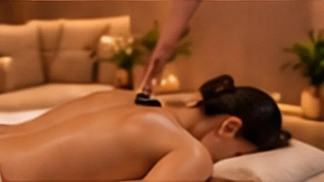Firm back massage in a warm, softly lit room